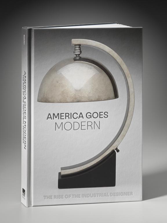 Cover of America Goes Modern, featuring silver art deco–style lamp